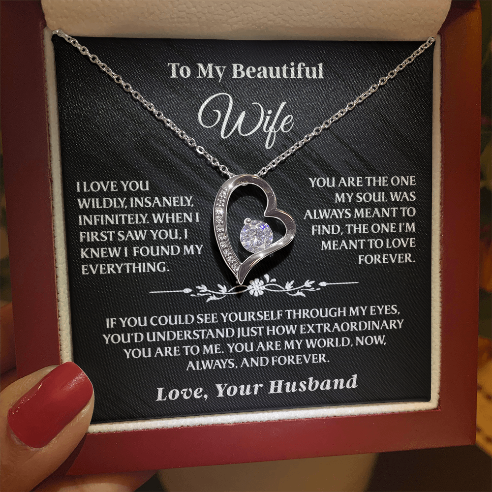To My Wife – Forever Love Necklace Gift Set with silver heart pendant, glowing under warm light in a red gift box with romantic message.
