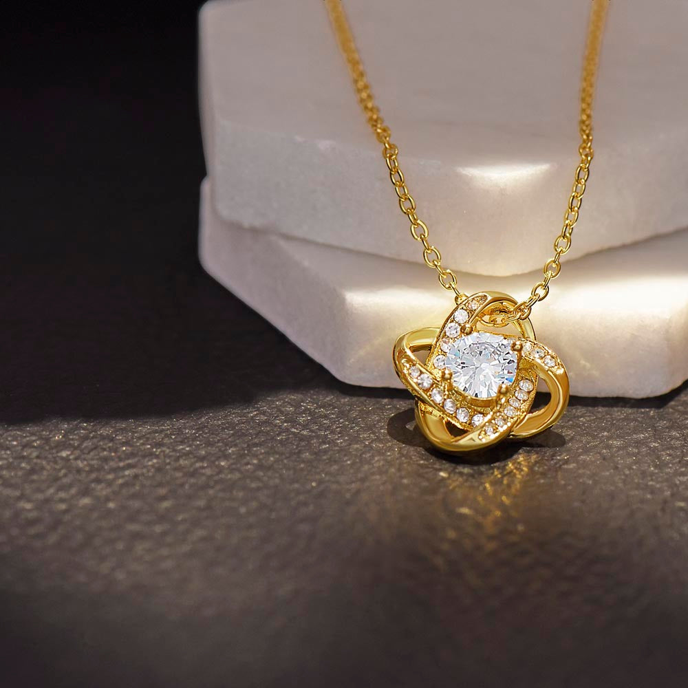 Close-up of gold Love Knot Necklace from the To My Beautiful Wife - Love Knot Gift Set - AA17, highlighting its sparkling center stone and elegant design.