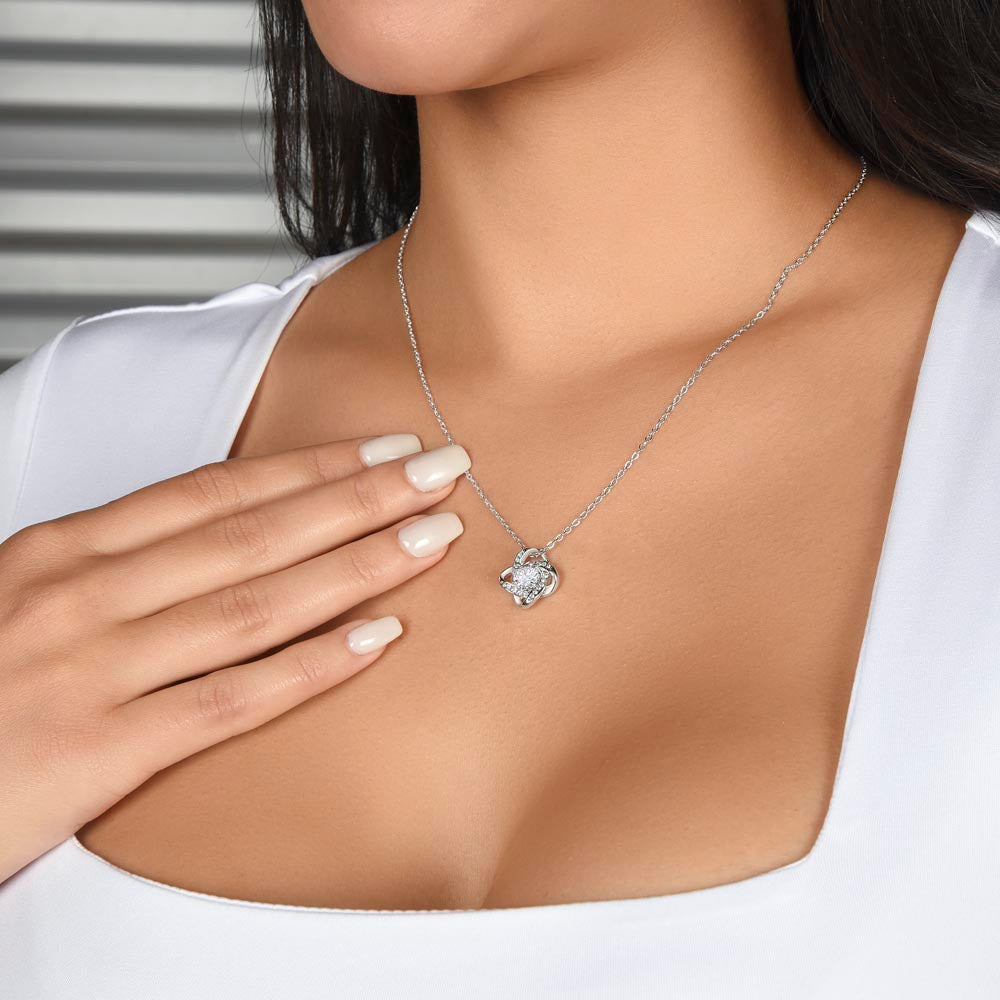 Model wearing the silver Love Knot Necklace from the To My Beautiful Wife - Love Knot Gift Set - AA17, showcasing its elegant design on neckline.